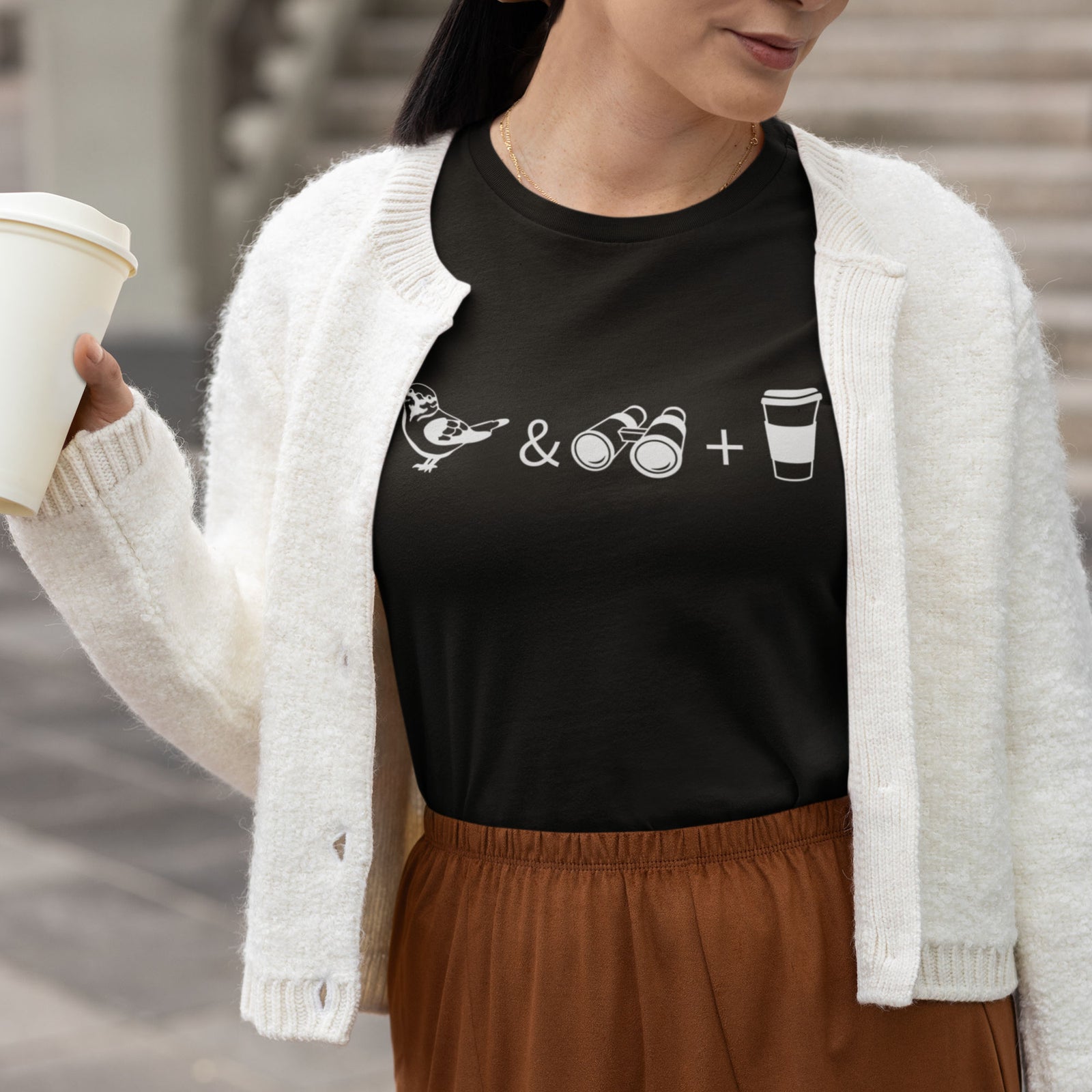 Black women's bird t-shirt celebrating bird watching and coffee with a graphic of binoculars, a bird, and a travel cup of coffee.