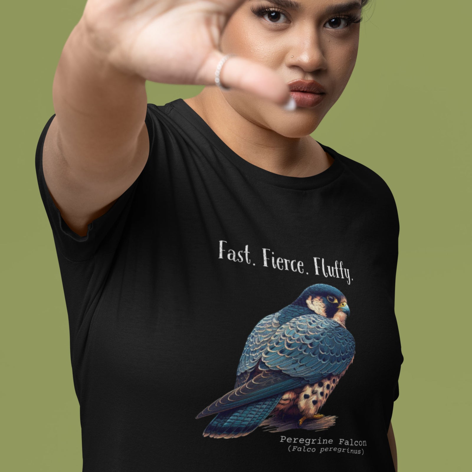 A black women's bird shirt with the words, "Fast. Fierce. Fluffy" above an illustration of a peregrine falcon.