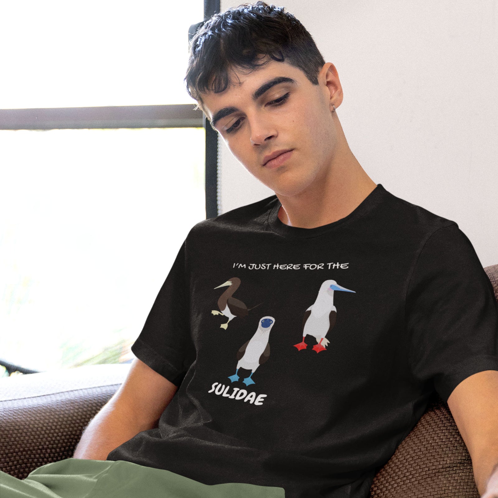 Black birder shirt with a red-footed, blue-footed and brown booby on it, but referencing only the scientific family name for the bird.