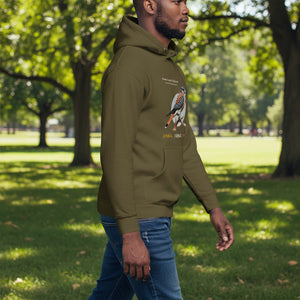 Military green hooded unisex bird sweatshirt with the words, "Small. Fierce. Fluffy" below an illustration of an American Kestrel. Worn by a man.