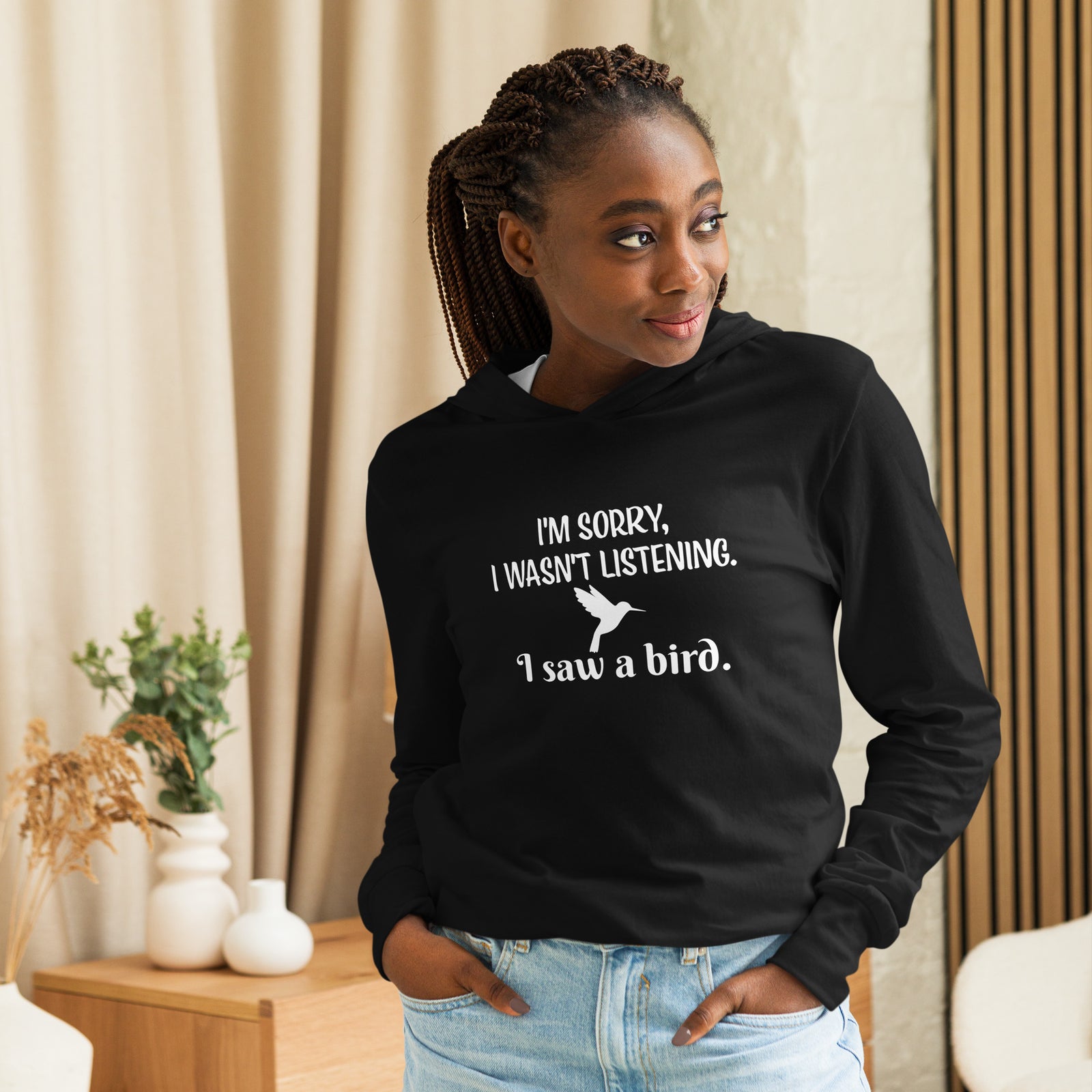 Black  long-sleeved bird t-shirt with the words I'm sorry I wasn't listening, I saw a bird. And a graphic of a hummingbird flying.