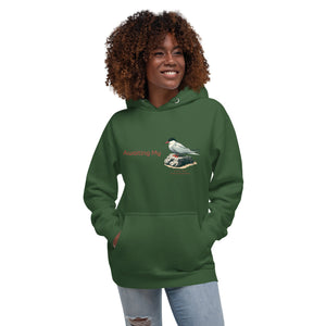 Green unisex hoodie with a graphic of an Arctic Tern on a rock, and the words "Awaiting My" next to it in a fun pun. The words Arctic Tern and the scientific name of Sterna Paradisaea are below the bird. Worn by a woman.