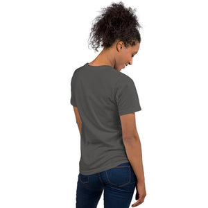 A dark gray bird shirt with the words, "Small. Fierce. Fluffy" below an illustration of an American Kestrel. Worn by a woman