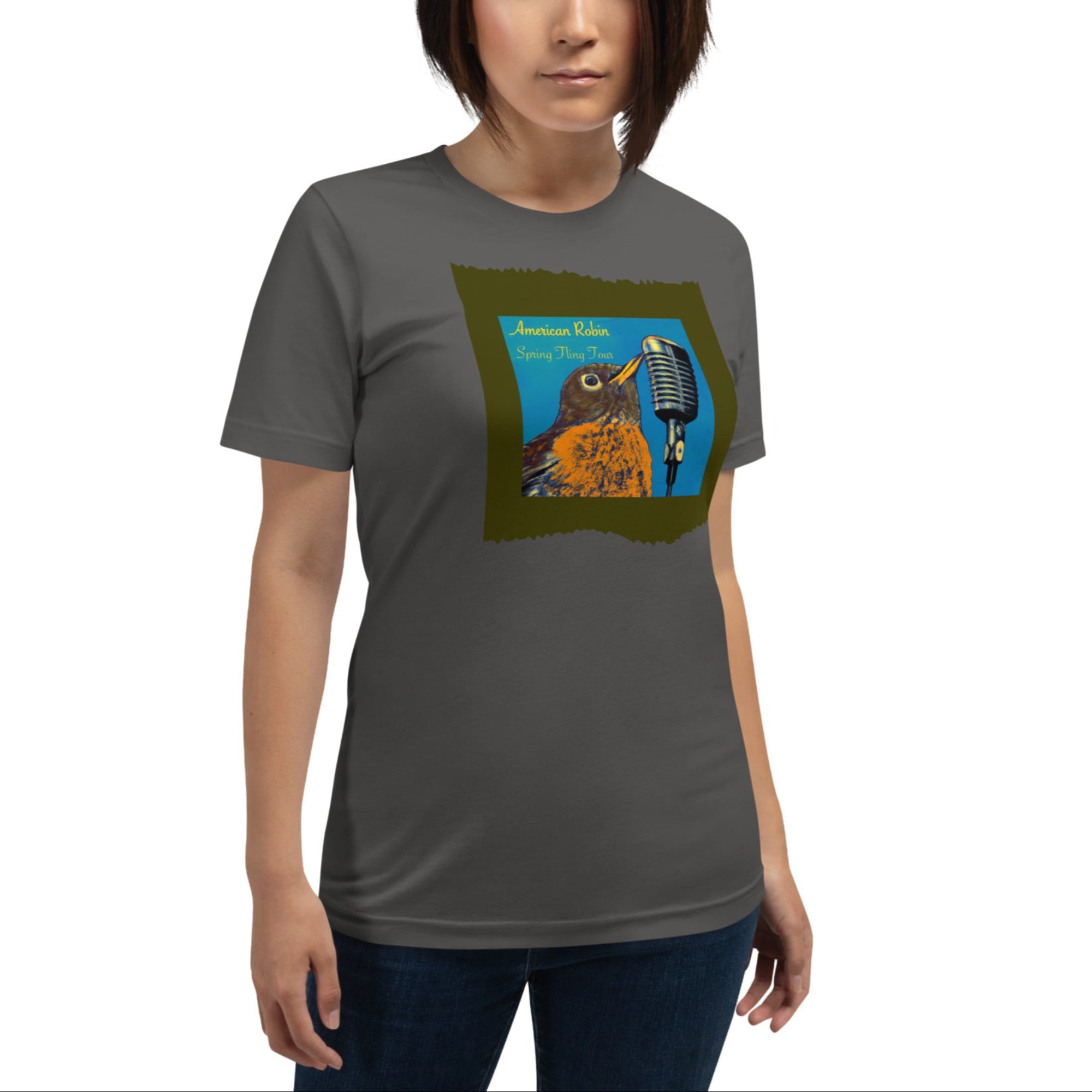 Dark gray unisex bird t-shirt featuring an illustration of an American Robin and a microphone and the words American Robin, Spring Fling Tour. Worn by a woman.