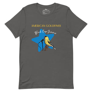 Gray unisex bird shirt featuring an American goldfinch singing into a microphone with a list of dates and cities on the back where the bird is commonly seen.
