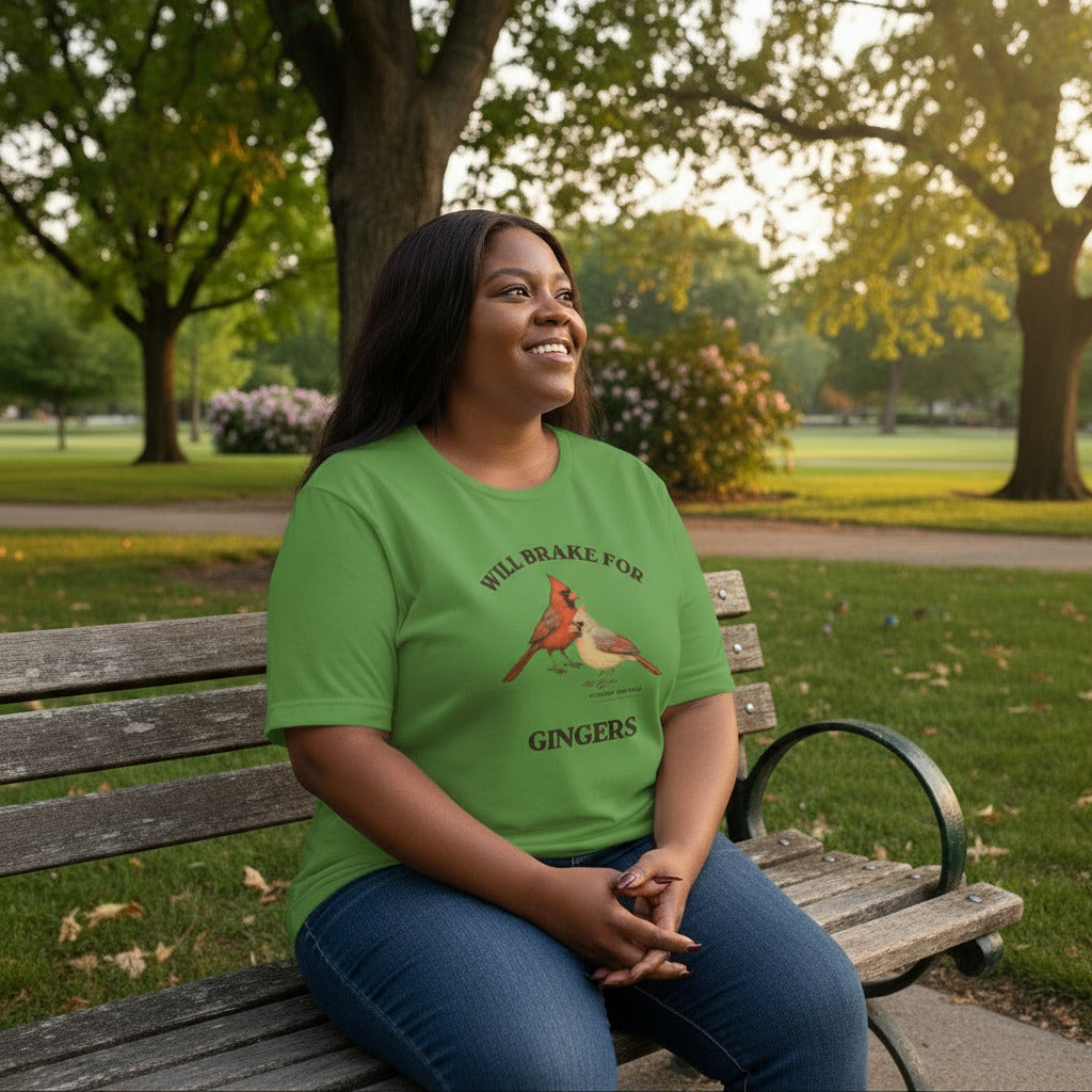 Leaf green bird shirt with a male and female northern cardinal and the words, "Will Brake for Gingers" worn by a woman.