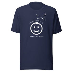 Navy blue unisex bird t-shirt with a smiley face looking up and to the side at a flock of birds surrounded by the words, "Easily Distracted" above and, "Mostly by Birds" below.