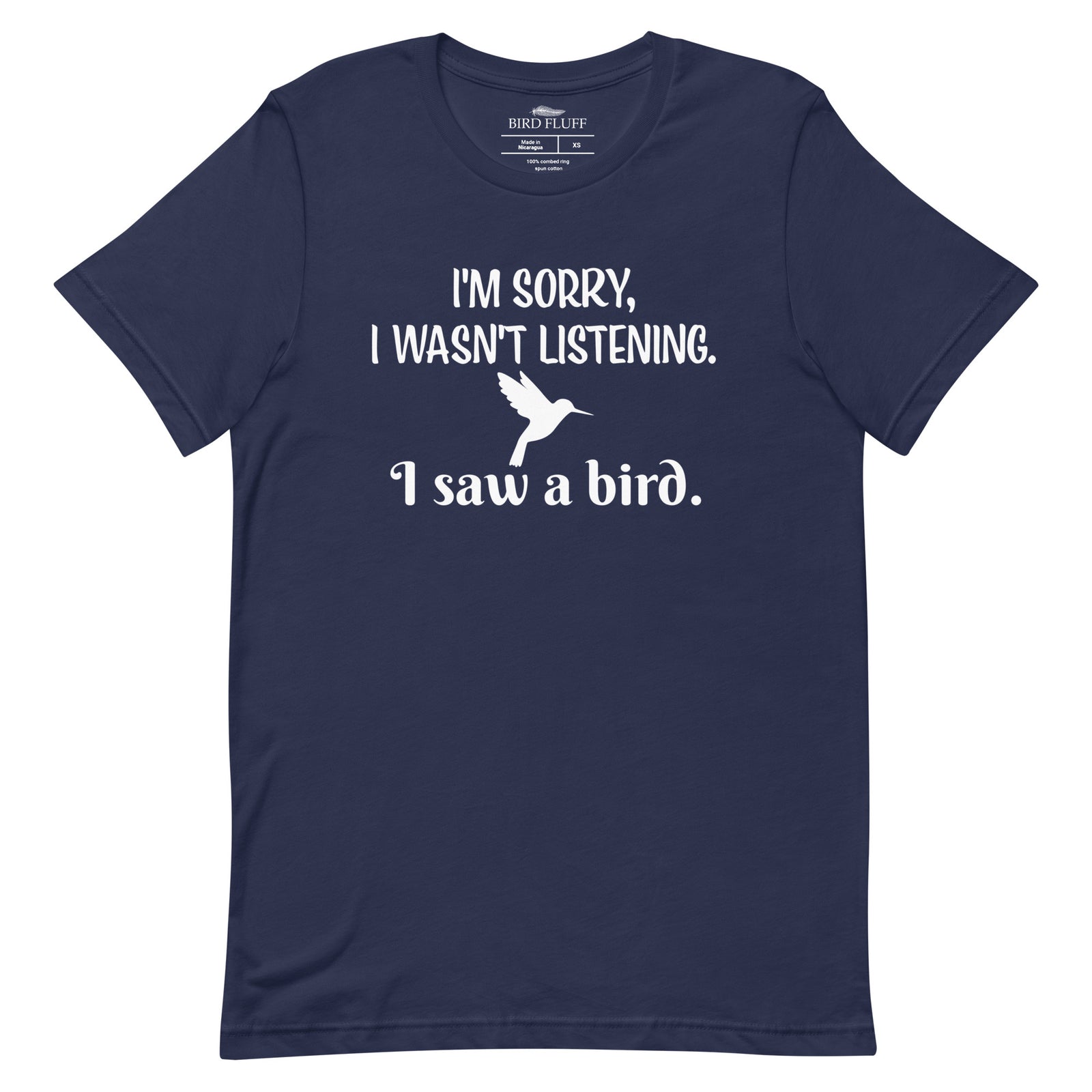 Navy blue bird t-shirt with the words I'm sorry I wasn't listening, I saw a bird. And a graphic of a hummingbird flying.