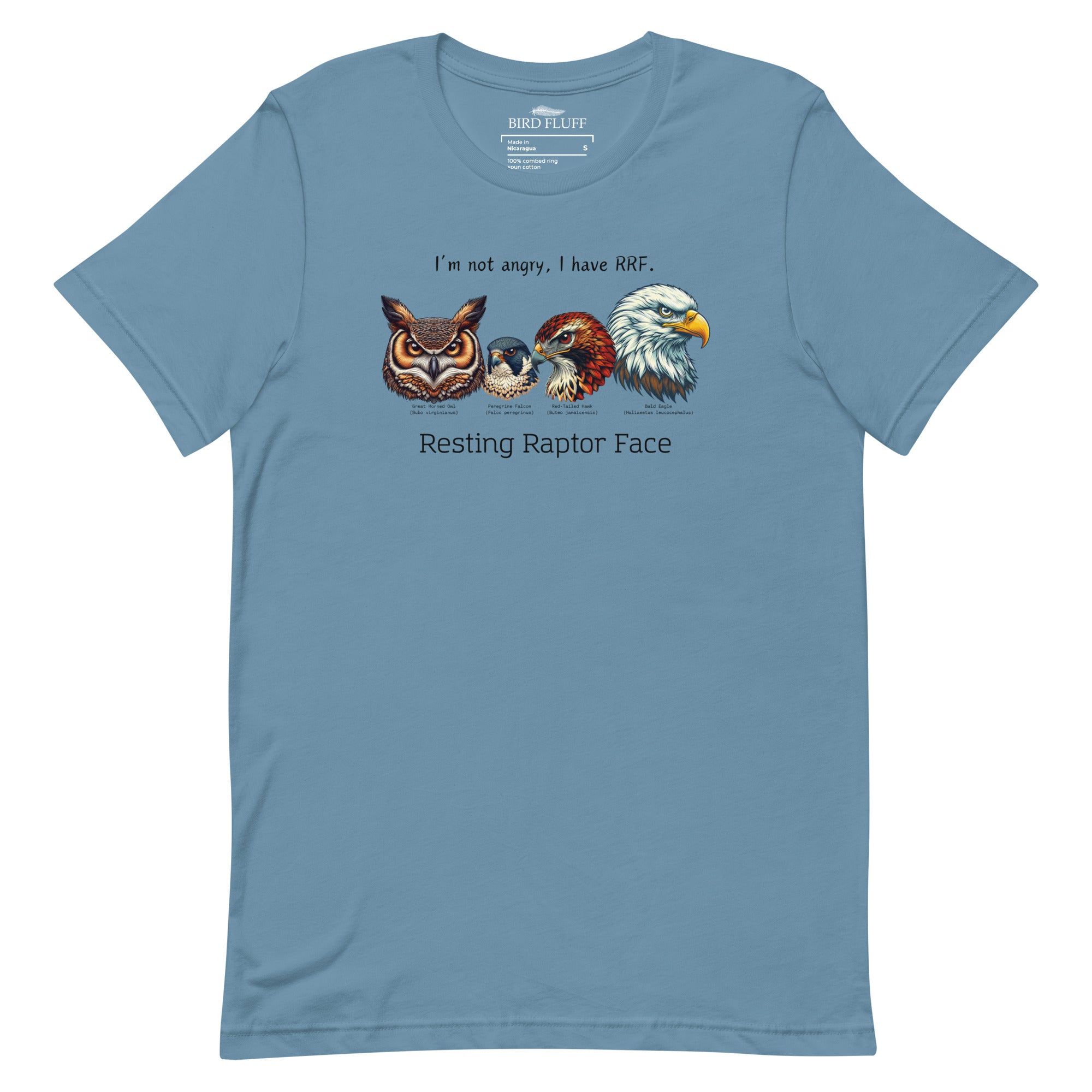 A steel blue bird shirt with a great horned owl, a peregrine falcon, a red-tailed hawk and a bald eagle. The shirt has text that says, I'm not angry, I have RRF. Resting Raptor Face.