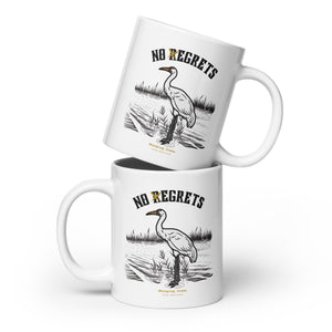 White 20-ounce mug featuring a play on the "No Regrets" tattoo that has the "R" crossed out to say "No Egrets" with a Whooping Crane below in a wetland setting.