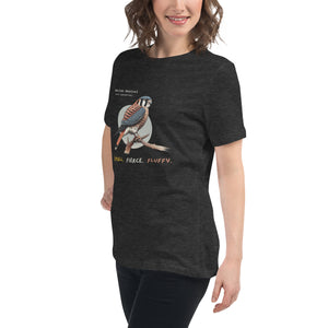 A dark heather gray women's bird shirt with the words, "Small. Fierce. Fluffy" below an illustration of an American Kestrel. Worn by a woman.