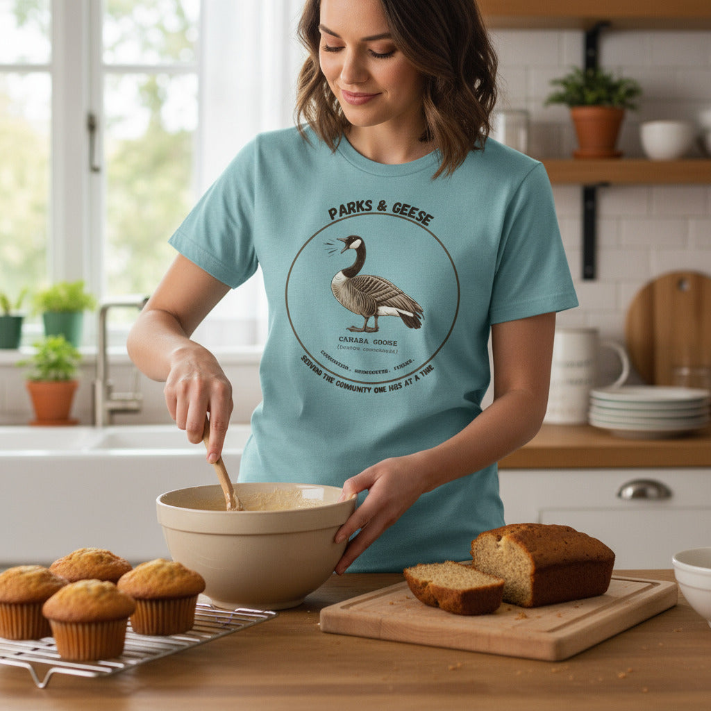 Women's relaxed fit light heather blue bird shirt with a canada goose on the front and a park department theme.