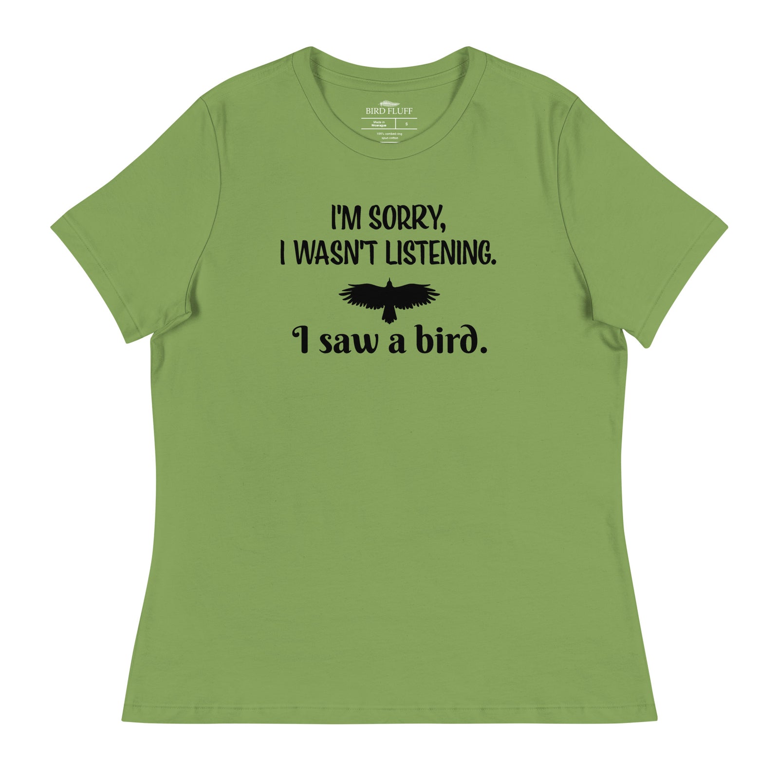 Leaf green women's bird t-shirt with the words I'm sorry I wasn't listening, I saw a bird. And a graphic of a bird flying.