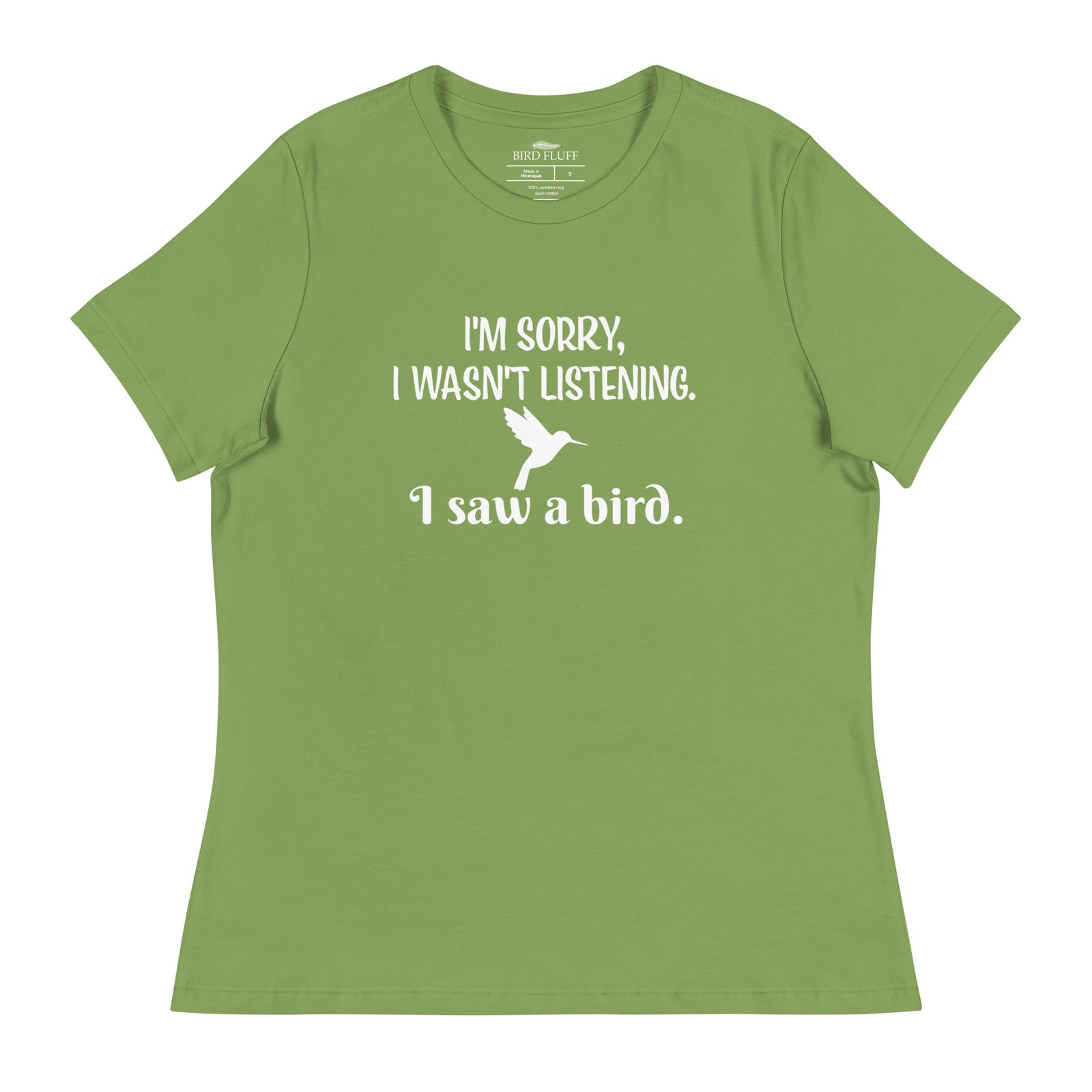 Leaf green women's relaxed crew neck bird t-shirt with the words I'm sorry I wasn't listening, I saw a bird. And a graphic of a hummingbird flying.
