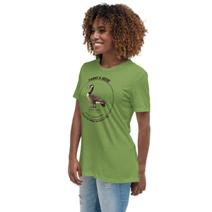 Women's relaxed fit bright green bird shirt with a canada goose on the front and a park department theme. Worn by a woman.