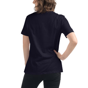 A navy women's bird shirt with the words, "Small. Fierce. Fluffy" below an illustration of an American Kestrel. Worn by a woman. Rear view shown, no graphics.