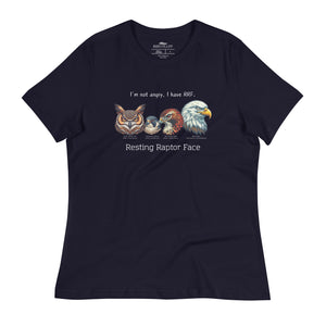 A navy blue bird shirt with a great horned owl, a peregrine falcon, a red-tailed hawk and a bald eagle. The shirt has text that says, I'm not angry, I have RRF. Resting Raptor Face.