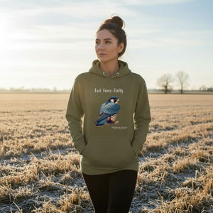 Military green, long-sleeve, bird hoodie with a peregrine falcon under the words, Fast, Fierce, Fluffy. Worn by a woman walking in a farm field.