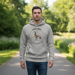 Unisex light heather gray bird hoodie with a canada goose on the front and a park department theme. Worn by a man in a park.
