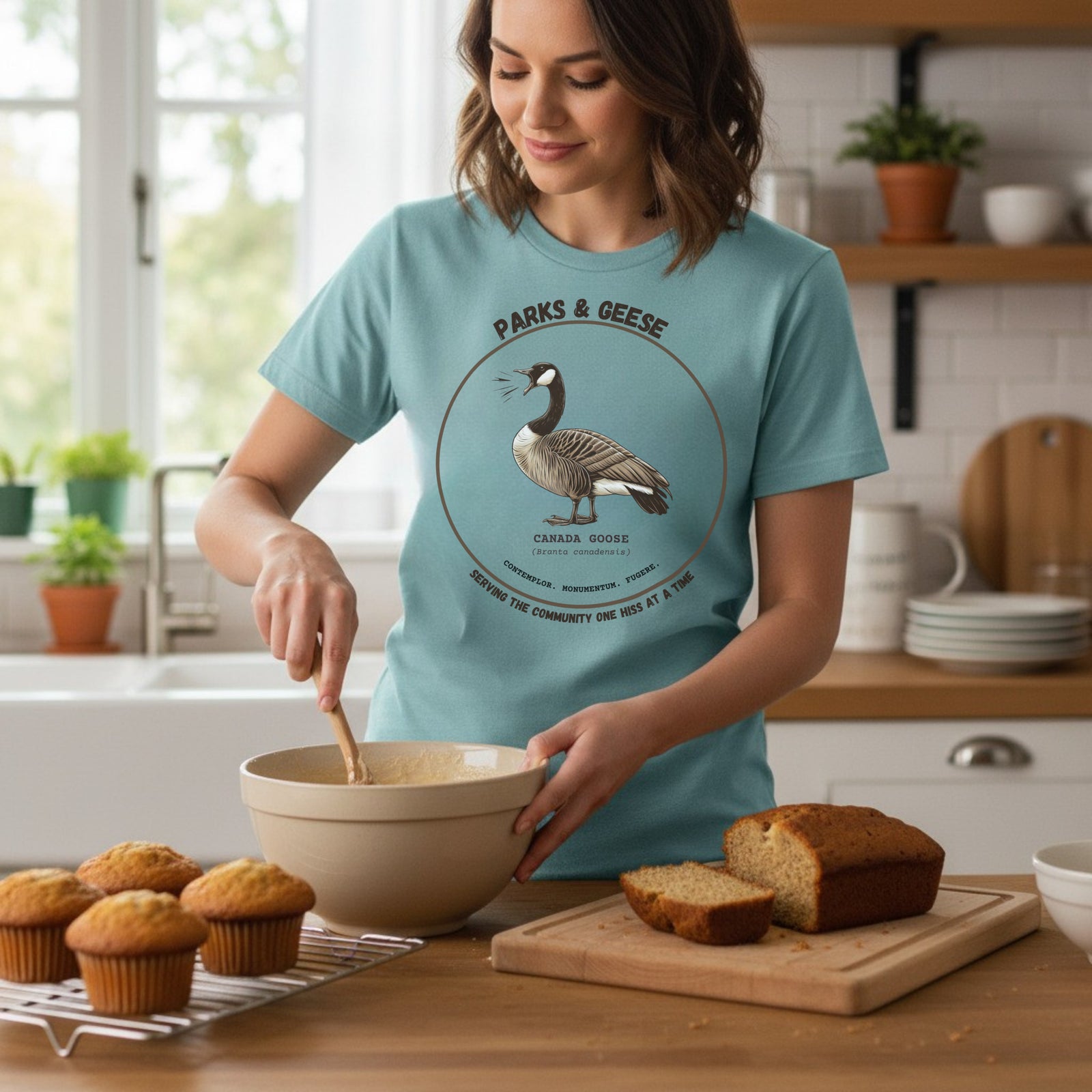 Women's relaxed fit light blue bird shirt with a canada goose on the front and a park department theme. 