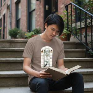 Person reading a book on steps wearing a t-shirt with Raven design featuring a Raven at Edgar Allan Poe's front door..