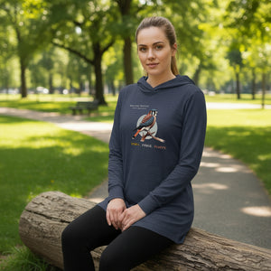 Heather navy long sleeved and hooded unisex bird shirt with the words, "Small. Fierce. Fluffy" below an illustration of an American Kestrel.  Worn by a woman.
