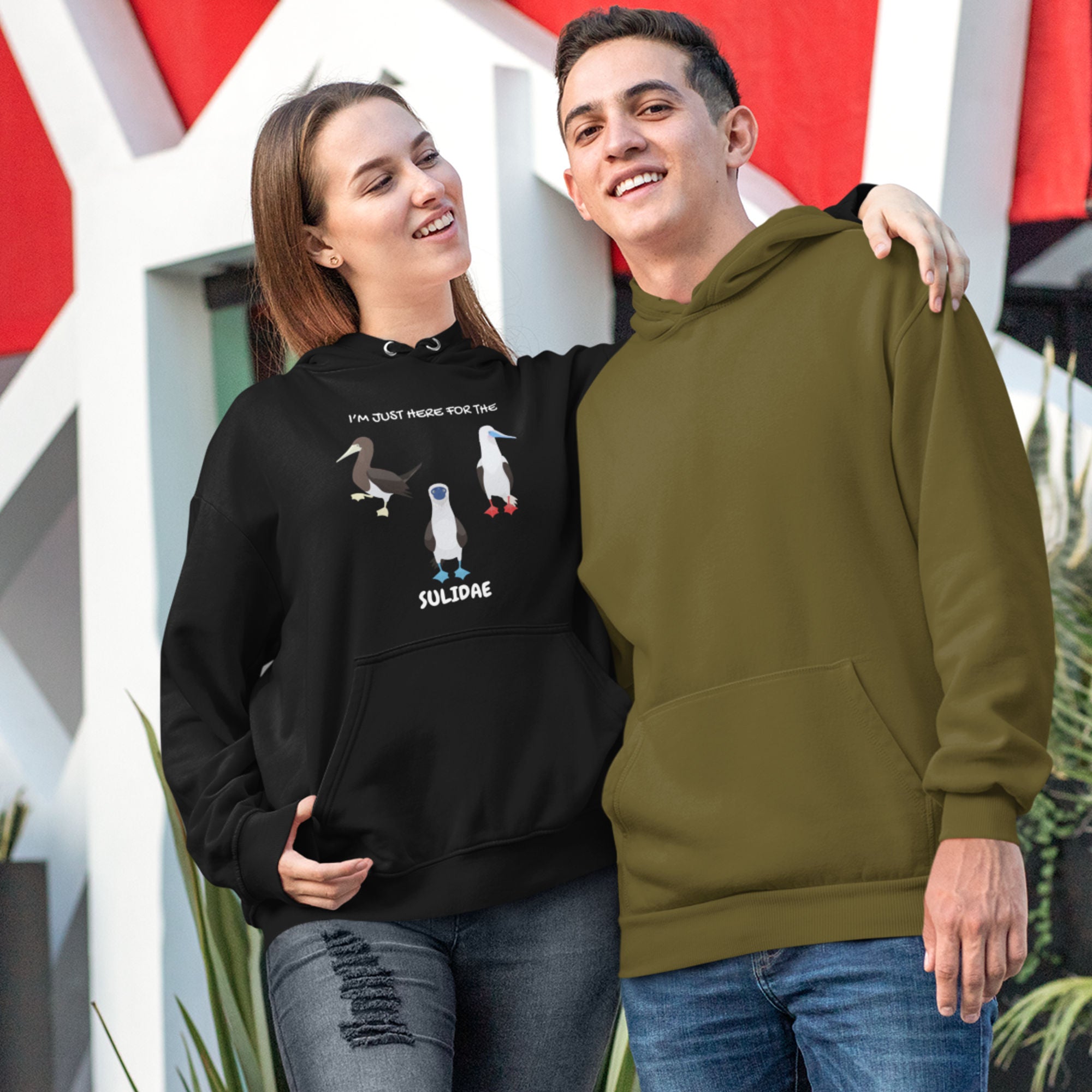 Black birder hoodie with a red-footed, blue-footed and brown booby on it, but referencing only the scientific family name for the bird.