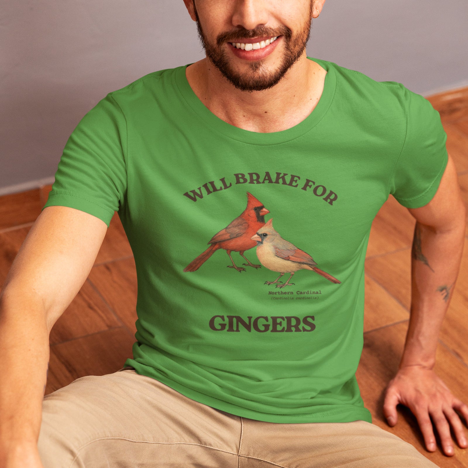 Leaf green bird shirt with a male and female northern cardinal and the words, "Will Brake for Gingers"