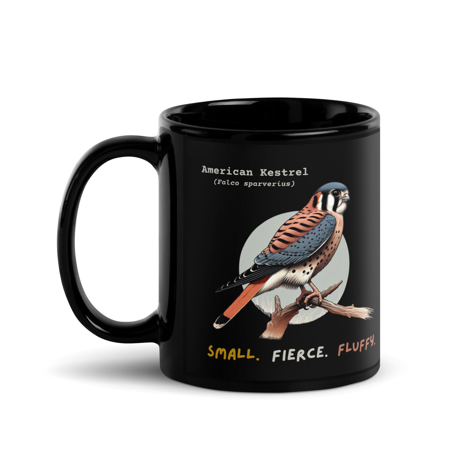 Black 11 oz ceramic mug with an American Kestrel design and the handle to the right.