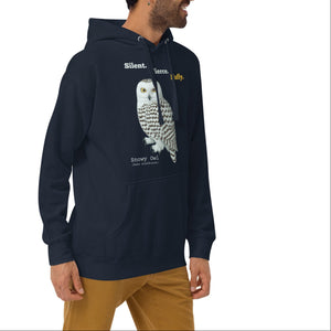 Person wearing a navy hoodie with snowy owl graphic and text on a white background