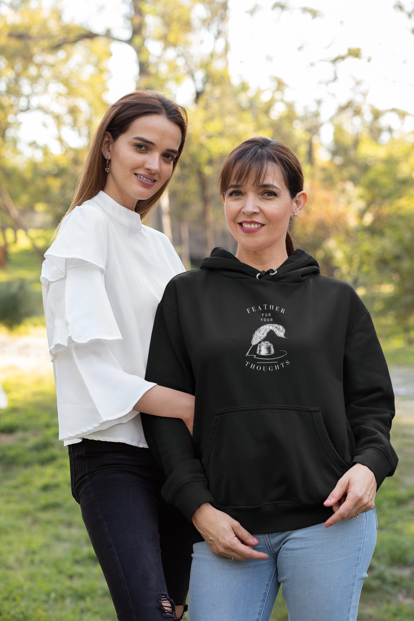 Black unisex hoodie with a quill and an ink pot and the words, "Feather for your Thoughts."