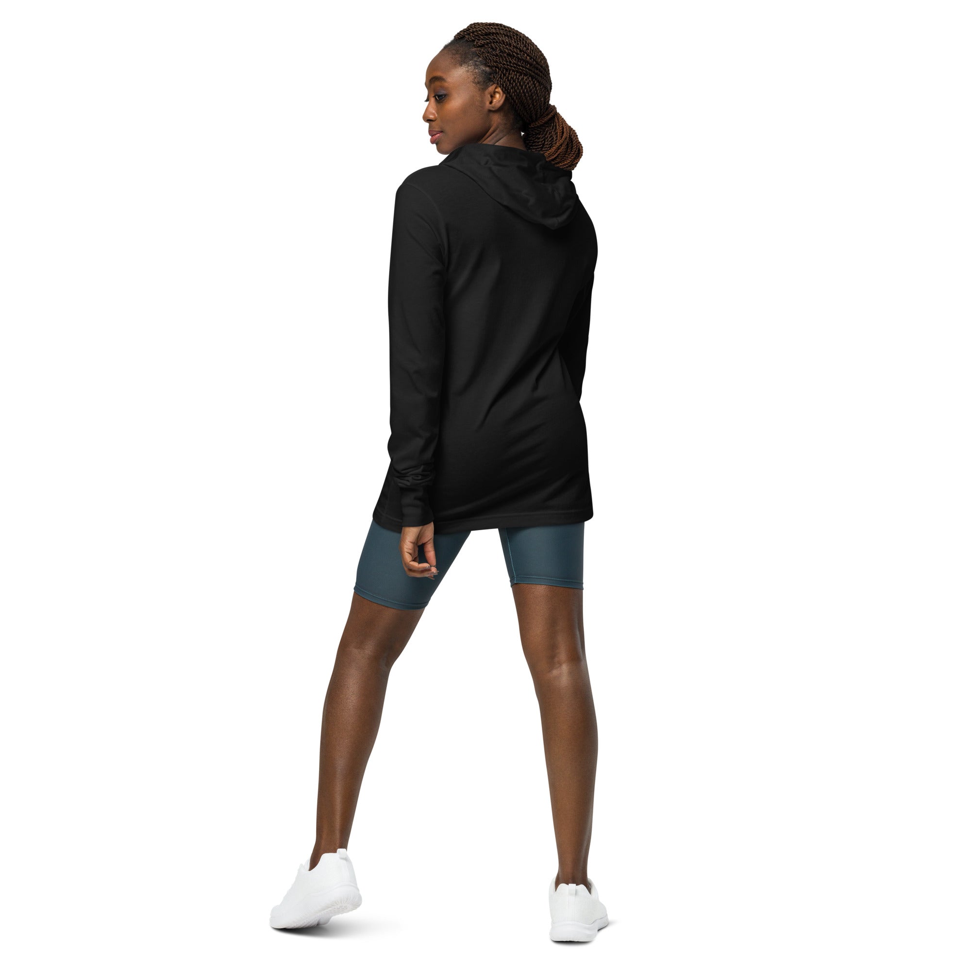 Black long sleeved and hooded unisex bird shirt with the words, "Small. Fierce. Fluffy" below an illustration of an American Kestrel. Worn by a woman, rear view, no graphics shown.