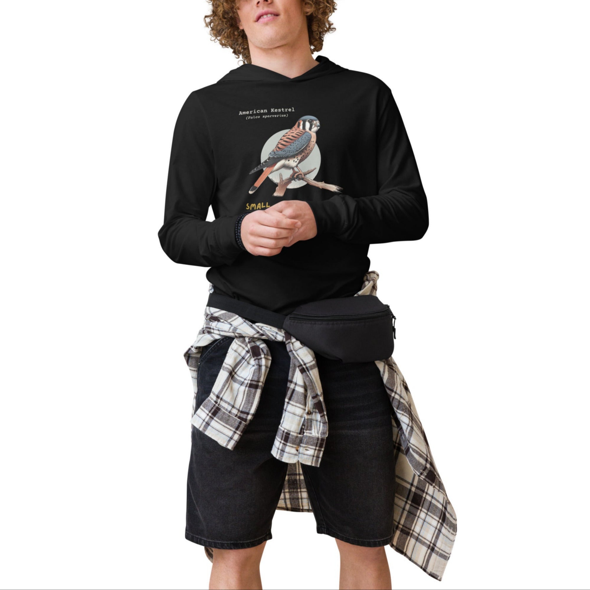 Black long sleeved and hooded unisex bird shirt with the words, "Small. Fierce. Fluffy" below an illustration of an American Kestrel. 