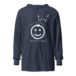 Heather navy blue long sleeved and hooded tee with fun, "Easily Distracted, Mostly by Birds" saying on the front, with a smiley face looking up at a flock of birds.