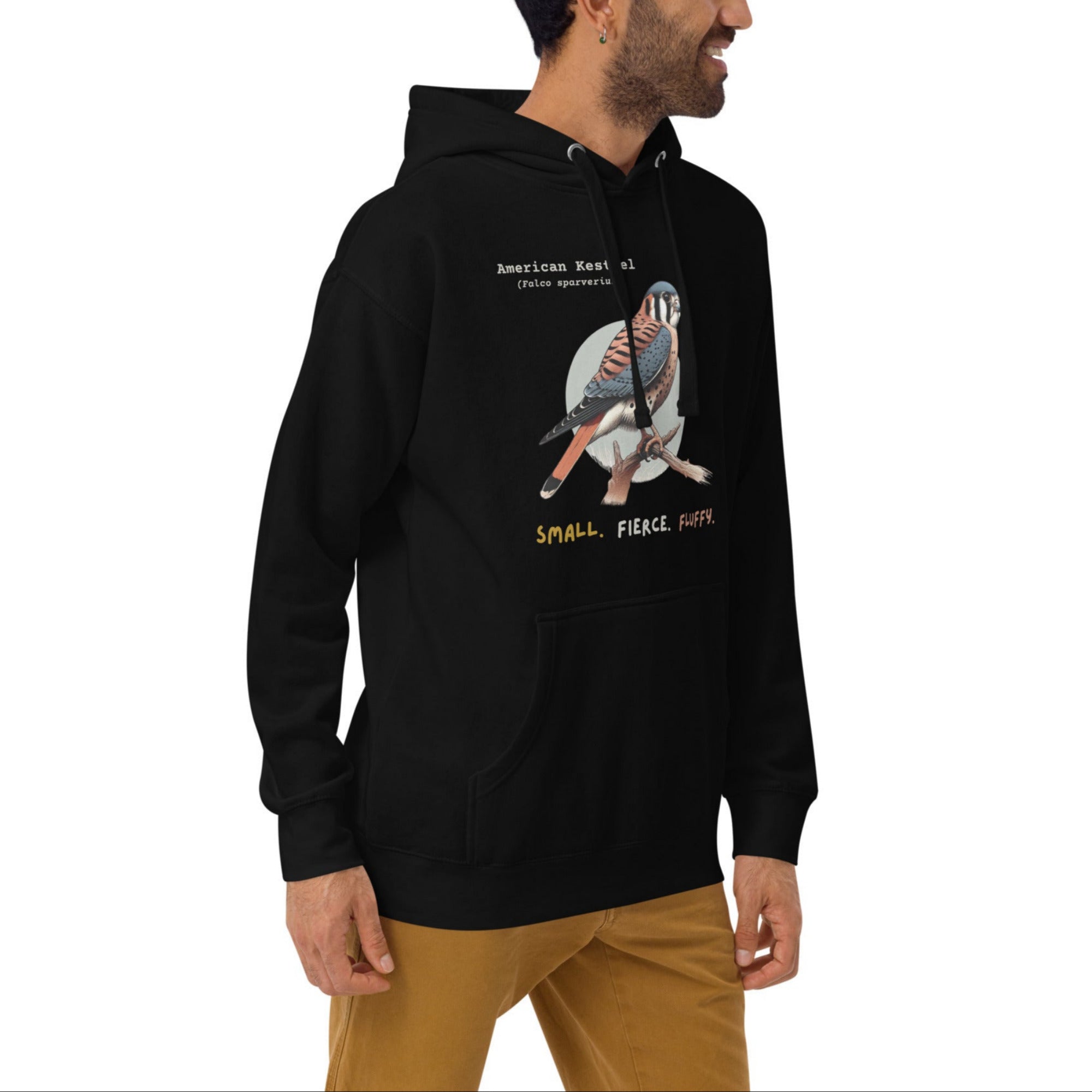 Black hooded unisex bird sweatshirt with the words, "Small. Fierce. Fluffy" below an illustration of an American Kestrel. 
