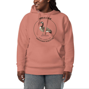 Unisex dusty rose bird hoodie with a canada goose on the front and a park department theme. Worn by a woman.