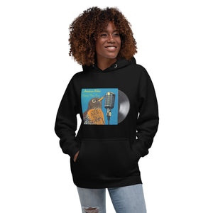 Concert style unisex hoodie in black; featuring an American Robin. Worn by a woman.