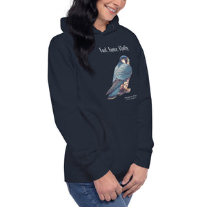 Navy, long-sleeve, bird hoodie with a peregrine falcon under the words, Fast, Fierce, Fluffy. Worn by a woman against a white background.