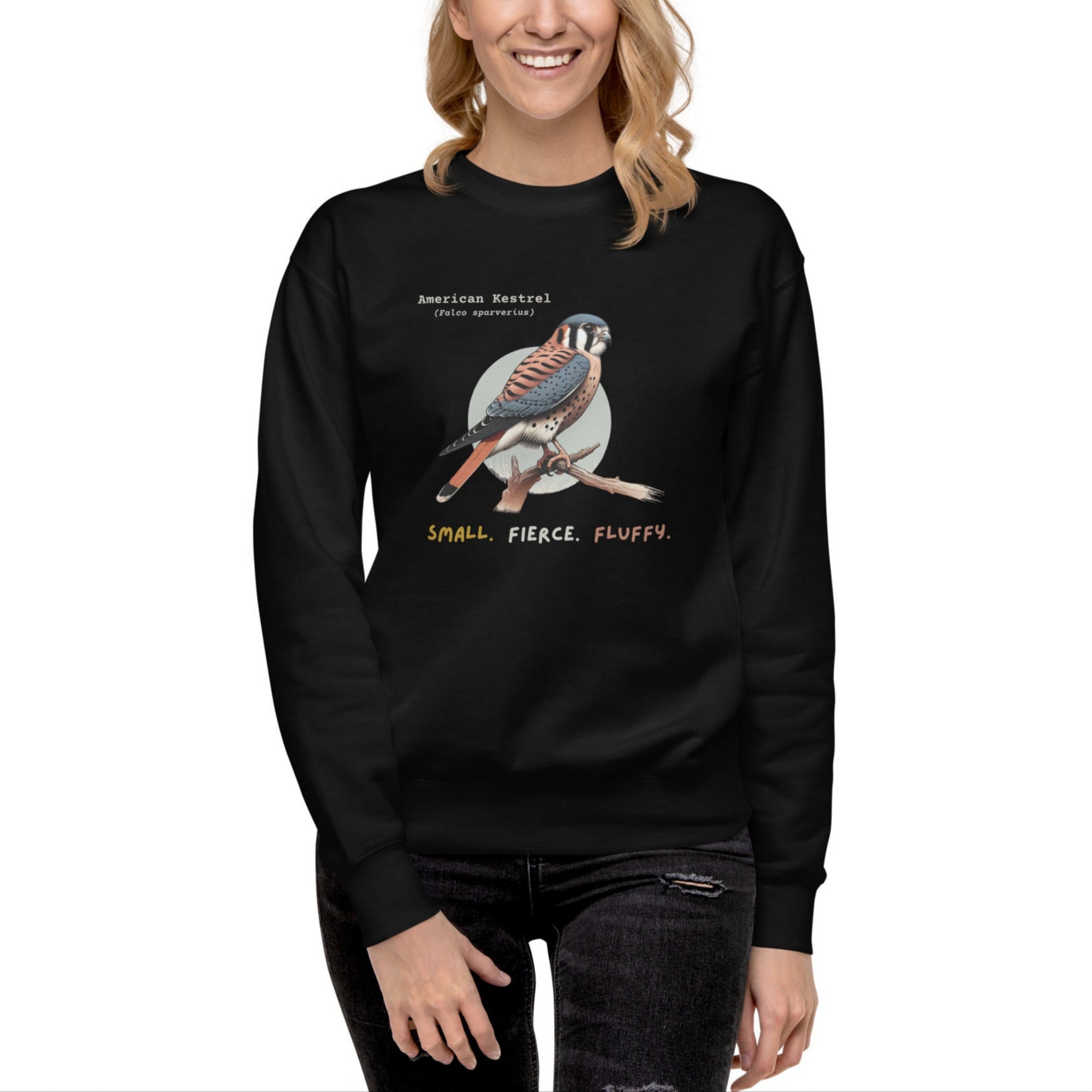 Black unisex bird sweatshirt with the words, "Small. Fierce. Fluffy" below an illustration of an American Kestrel. 