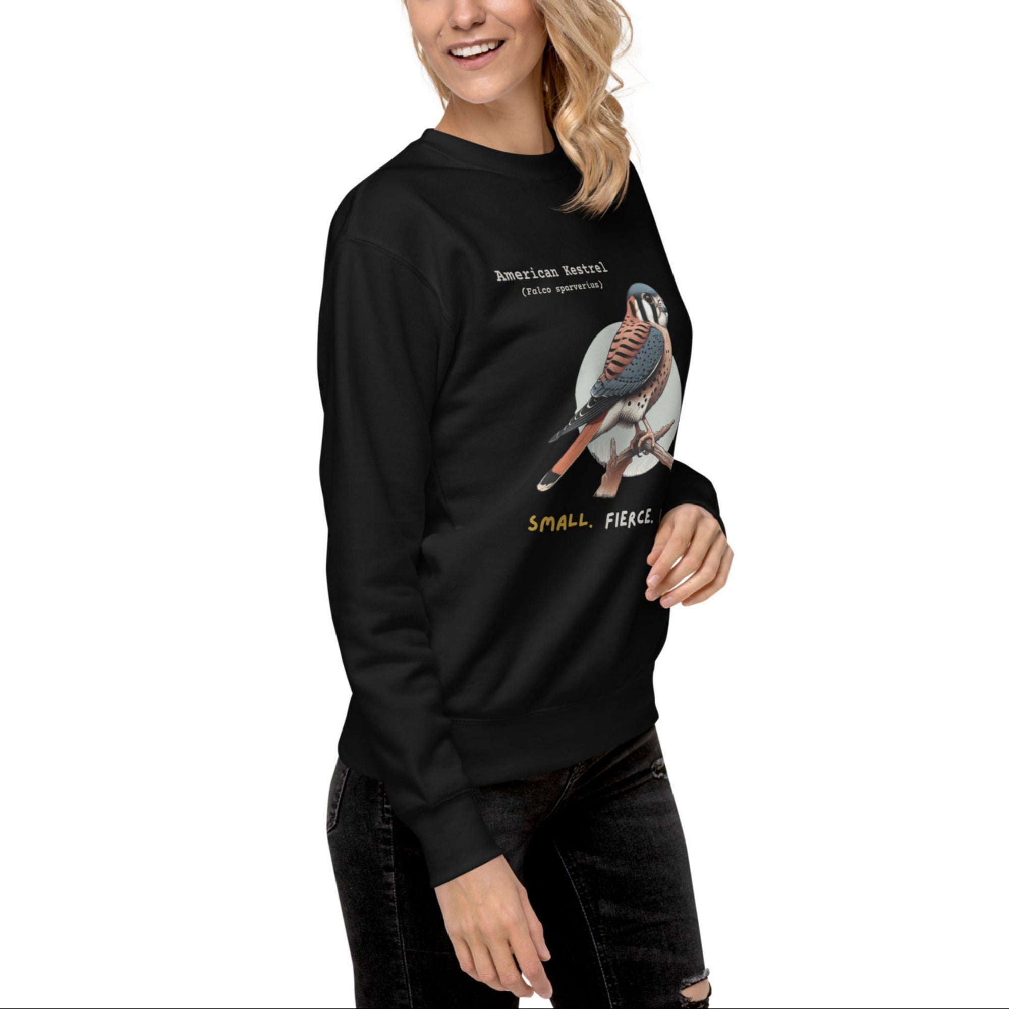 Black unisex bird sweatshirt with the words, "Small. Fierce. Fluffy" below an illustration of an American Kestrel. 