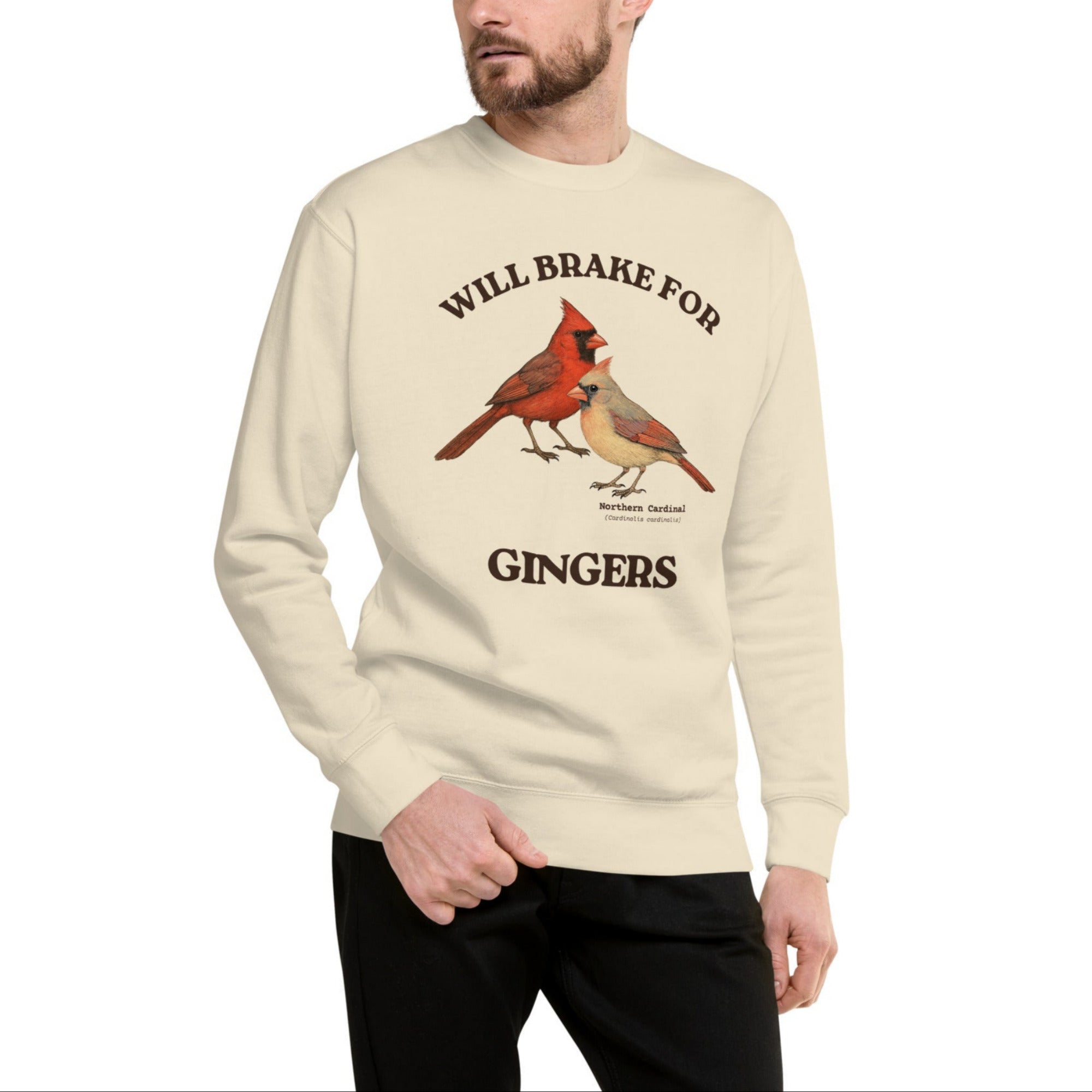 Bone colored sweatshirt with male and female cardinal design and text 'WILL BRAKE FOR GINGERS' worn by a man.