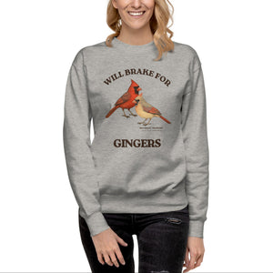 Gray sweatshirt with male and female cardinal design and text 'WILL BRAKE FOR GINGERS' Worn by a woman.