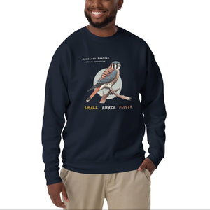 Navy unisex bird sweatshirt with the words, "Small. Fierce. Fluffy" below an illustration of an American Kestrel. Worn by a man.