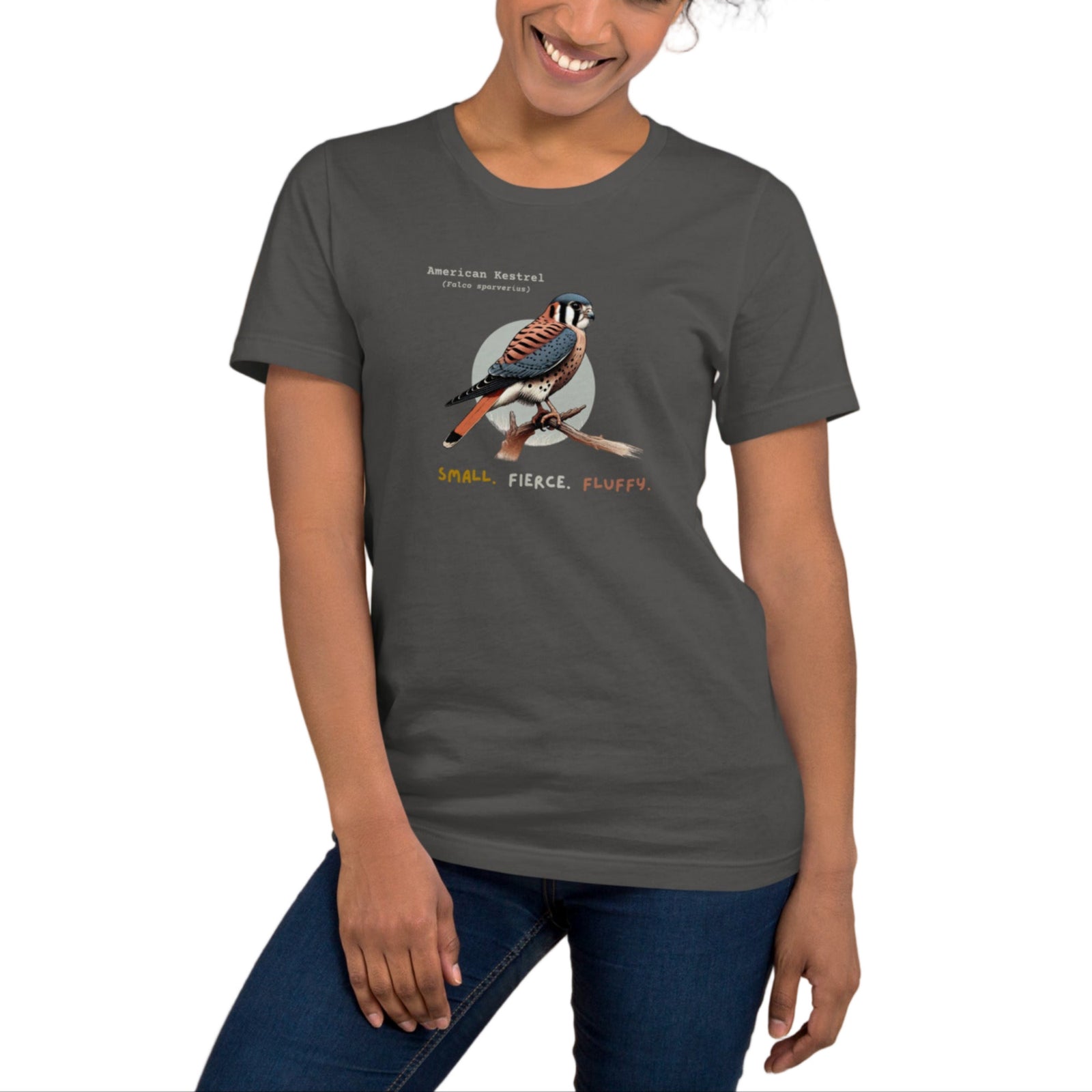 A dark gray bird shirt with the words, "Small. Fierce. Fluffy" below an illustration of an American Kestrel.