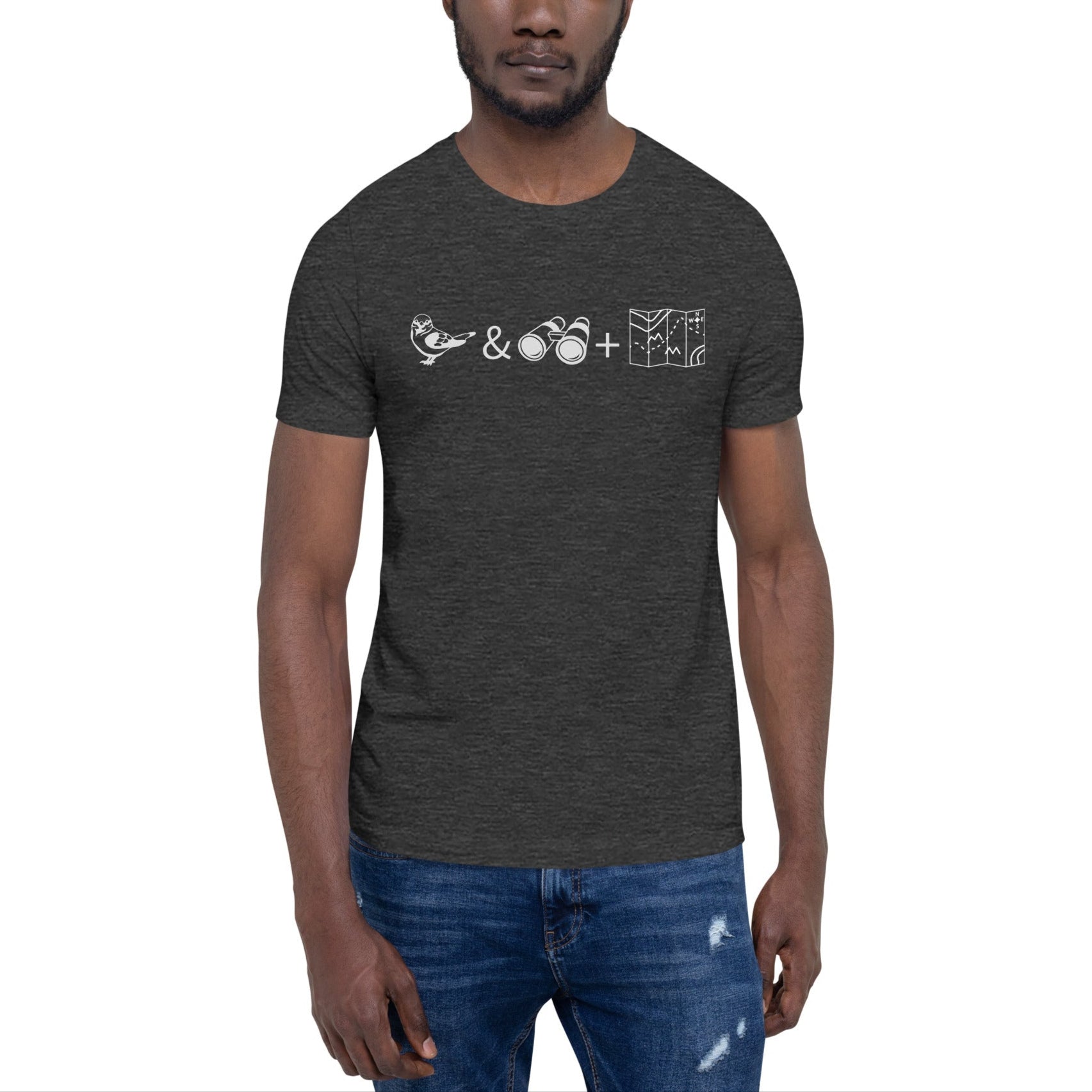 Unisex dark grey heather bird t-shirt celebrating bird watching and the backcountry with a graphic of binoculars, a bird, and a map. Worn by a man.
