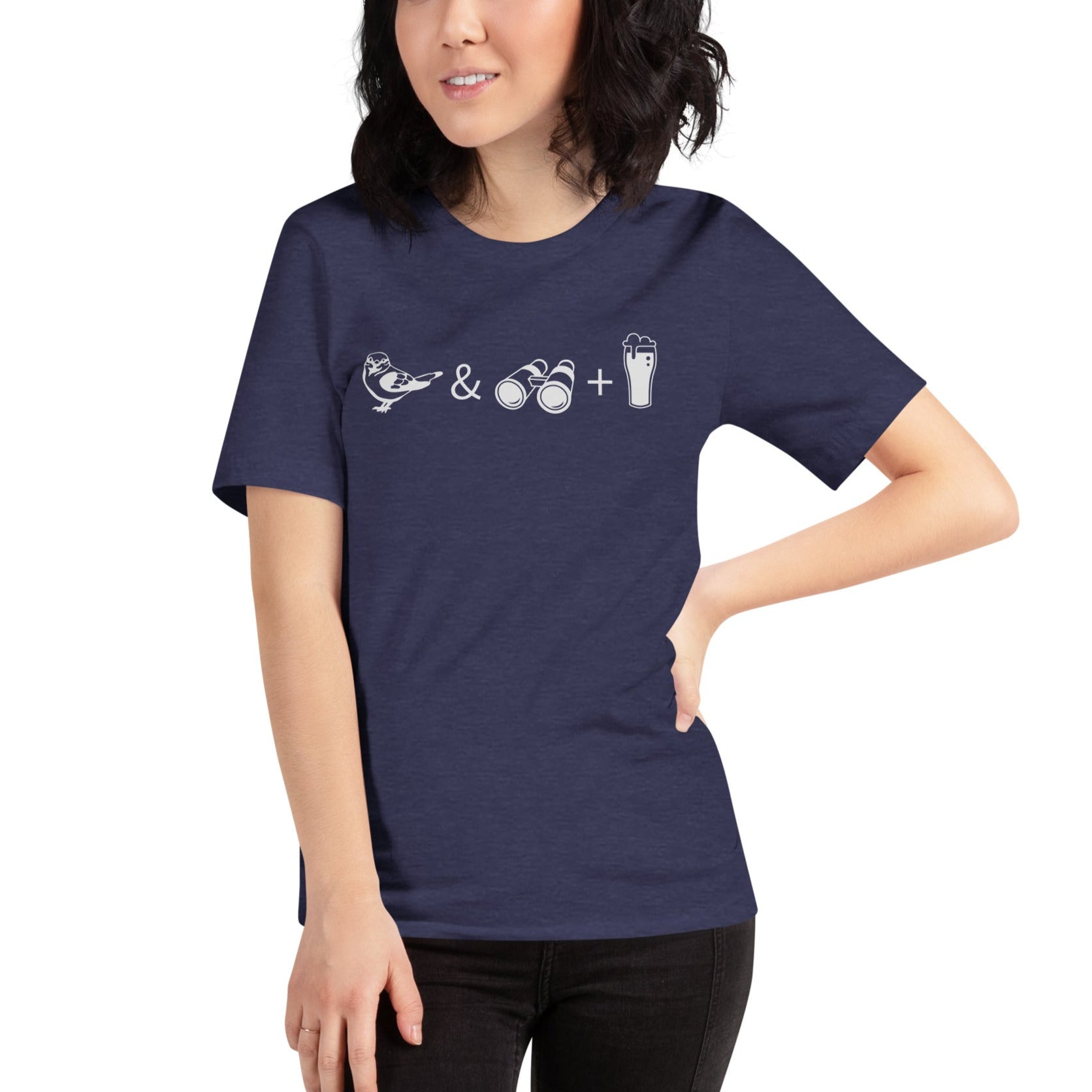 Unisex dark heather blue bird t-shirt celebrating bird watching and beer with a graphic of binoculars, a bird, and a glass of beer. Worn by a woman.