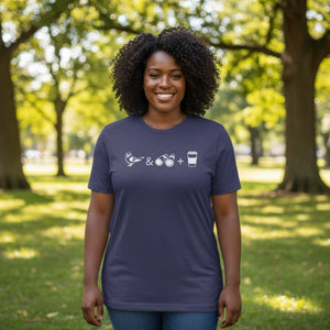 Navy heather bird shirt with a bird, binoculars and cup of coffee. Worn by a woman in a park.