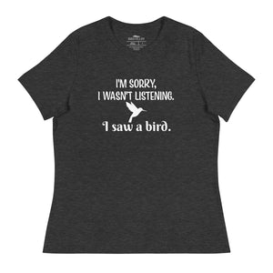 Dark heather grey women's relaxed crew neck bird t-shirt with the words I'm sorry I wasn't listening, I saw a bird. And a graphic of a hummingbird flying. 