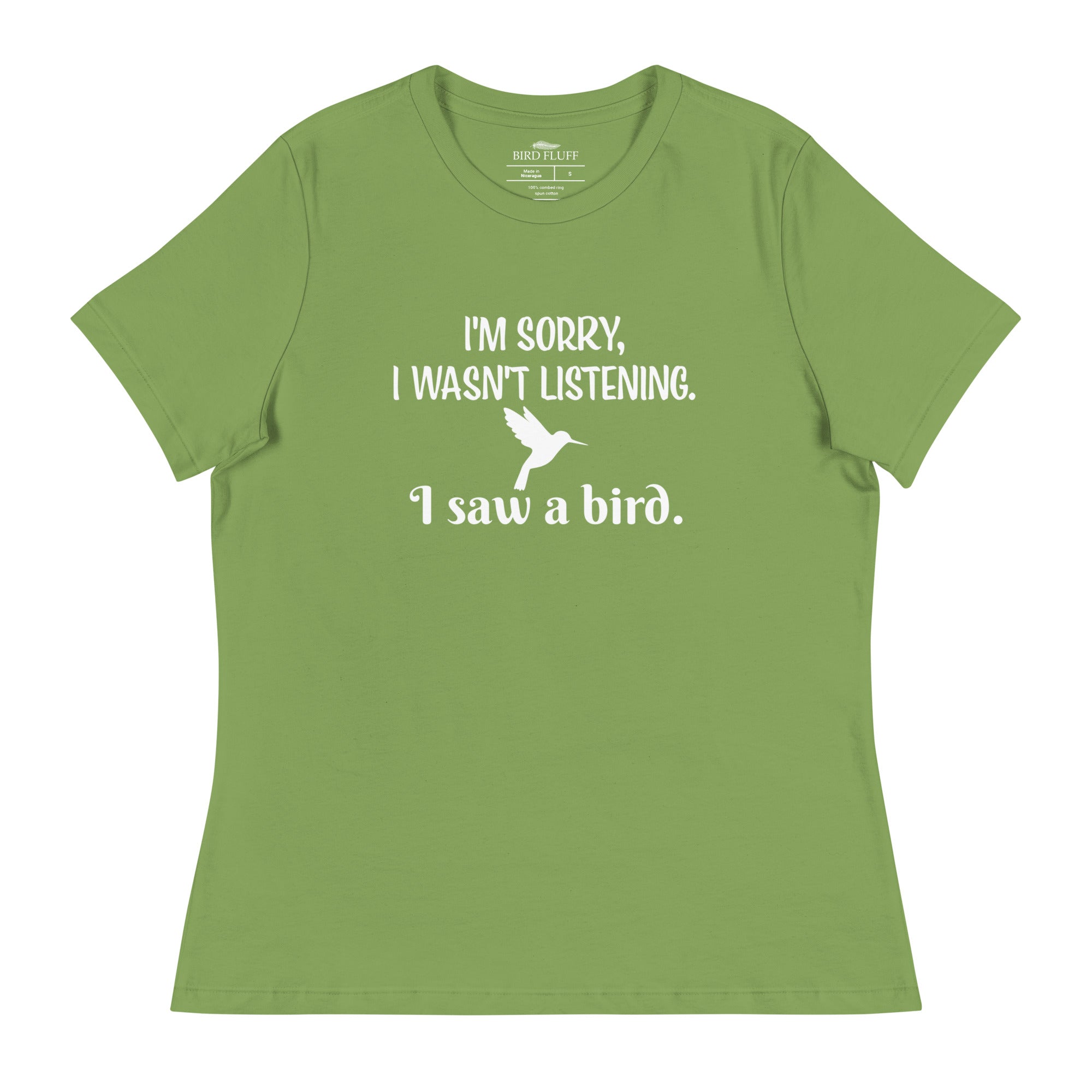Leaf green women's relaxed crew neck bird t-shirt with the words I'm sorry I wasn't listening, I saw a bird. And a graphic of a hummingbird flying.