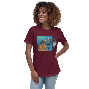 Concert style women's relaxed fit tee in black; featuring an American Robin. Shown being worn by a woman.